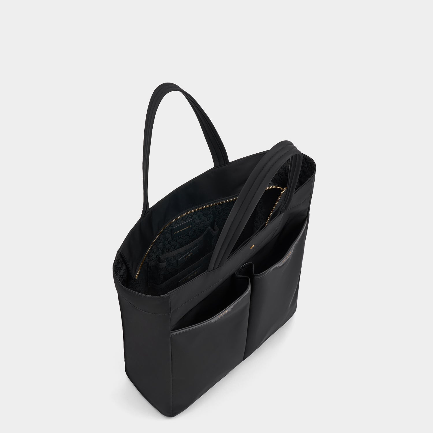 Nevis Tote -

          
            Regenerated ECONYL® in Black -
          

          Anya Hindmarch UK
