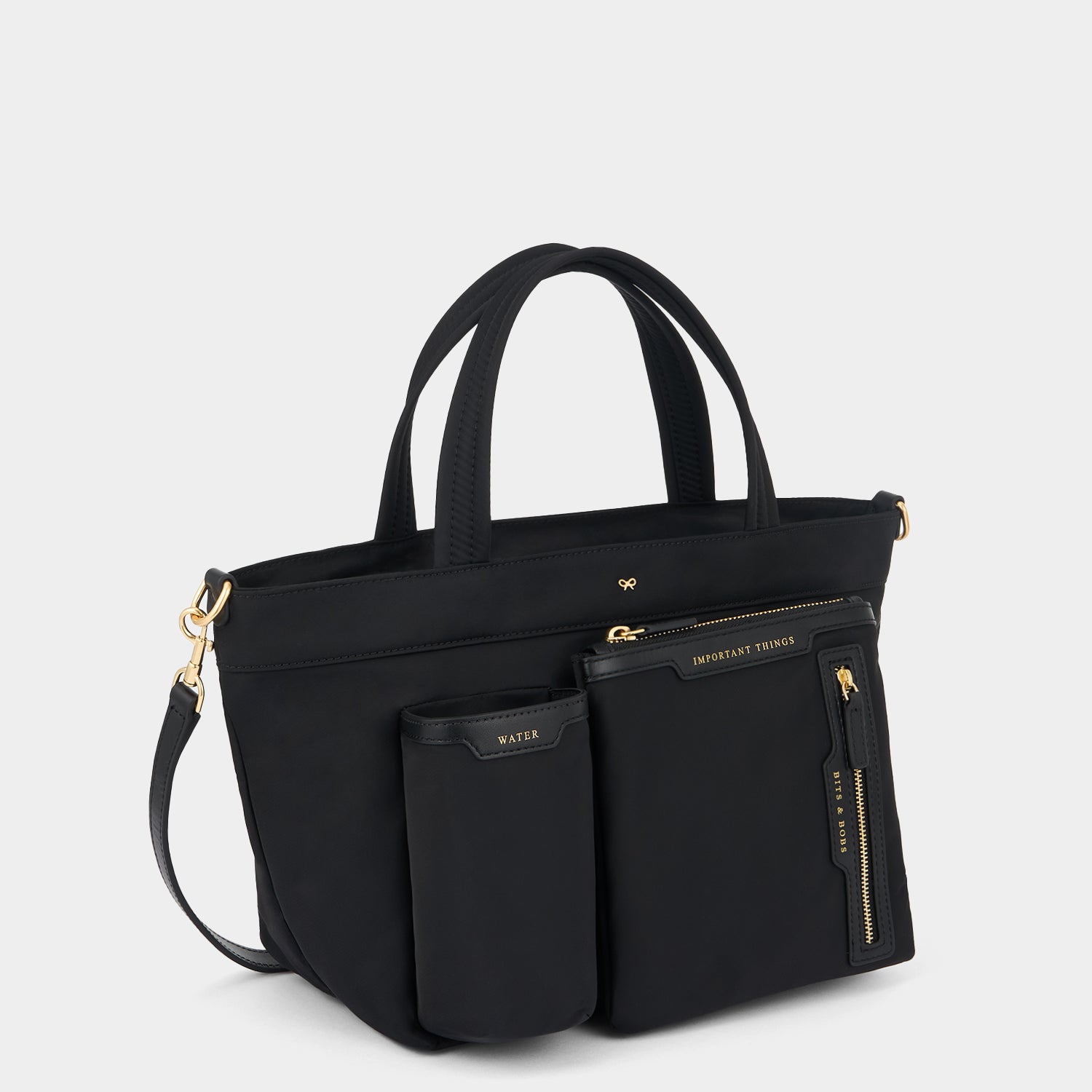 E/W Multi Pocket Mini Cross-body Tote -

          
            Regenerated ECONYL® in Black -
          

          Anya Hindmarch UK
