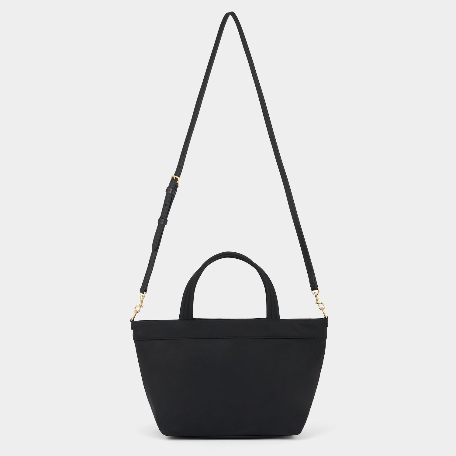 E/W Multi Pocket Mini Cross-body Tote -

          
            Regenerated ECONYL® in Black -
          

          Anya Hindmarch UK
