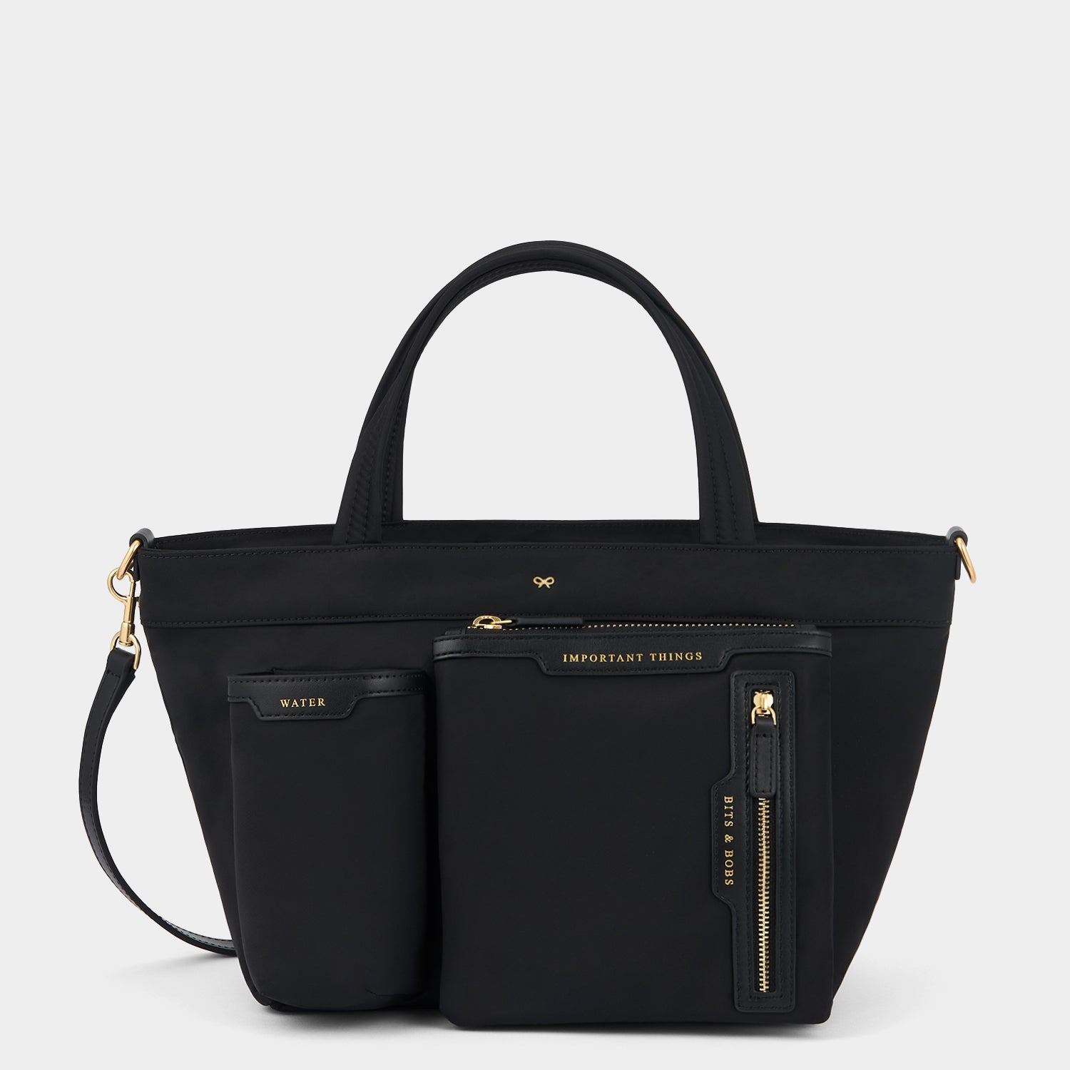 E/W Multi Pocket Mini Cross-body Tote -

          
            Regenerated ECONYL® in Black -
          

          Anya Hindmarch UK
