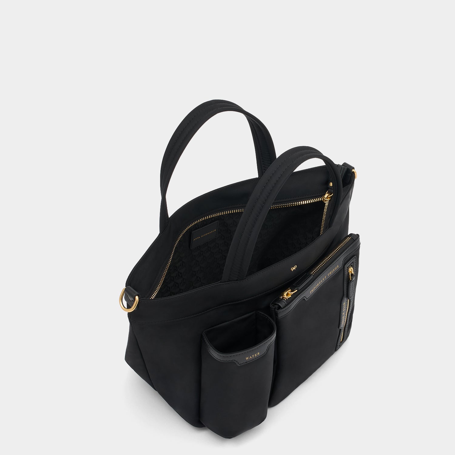 E/W Multi Pocket Mini Cross-body Tote -

          
            Regenerated ECONYL® in Black -
          

          Anya Hindmarch UK
