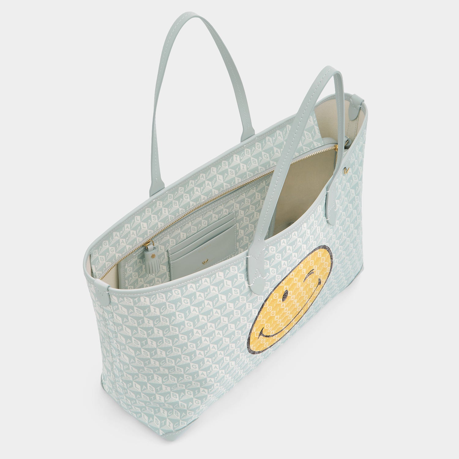 I Am A Plastic Bag Wink Zipped Tote -

          
            Recycled Canvas in Frost -
          

          Anya Hindmarch UK
