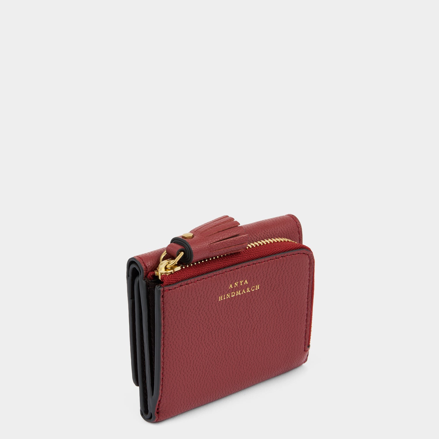 Peeping Eyes Mini Trifold Wallet -

          
            Capra Leather in Damson -
          

          Anya Hindmarch UK
