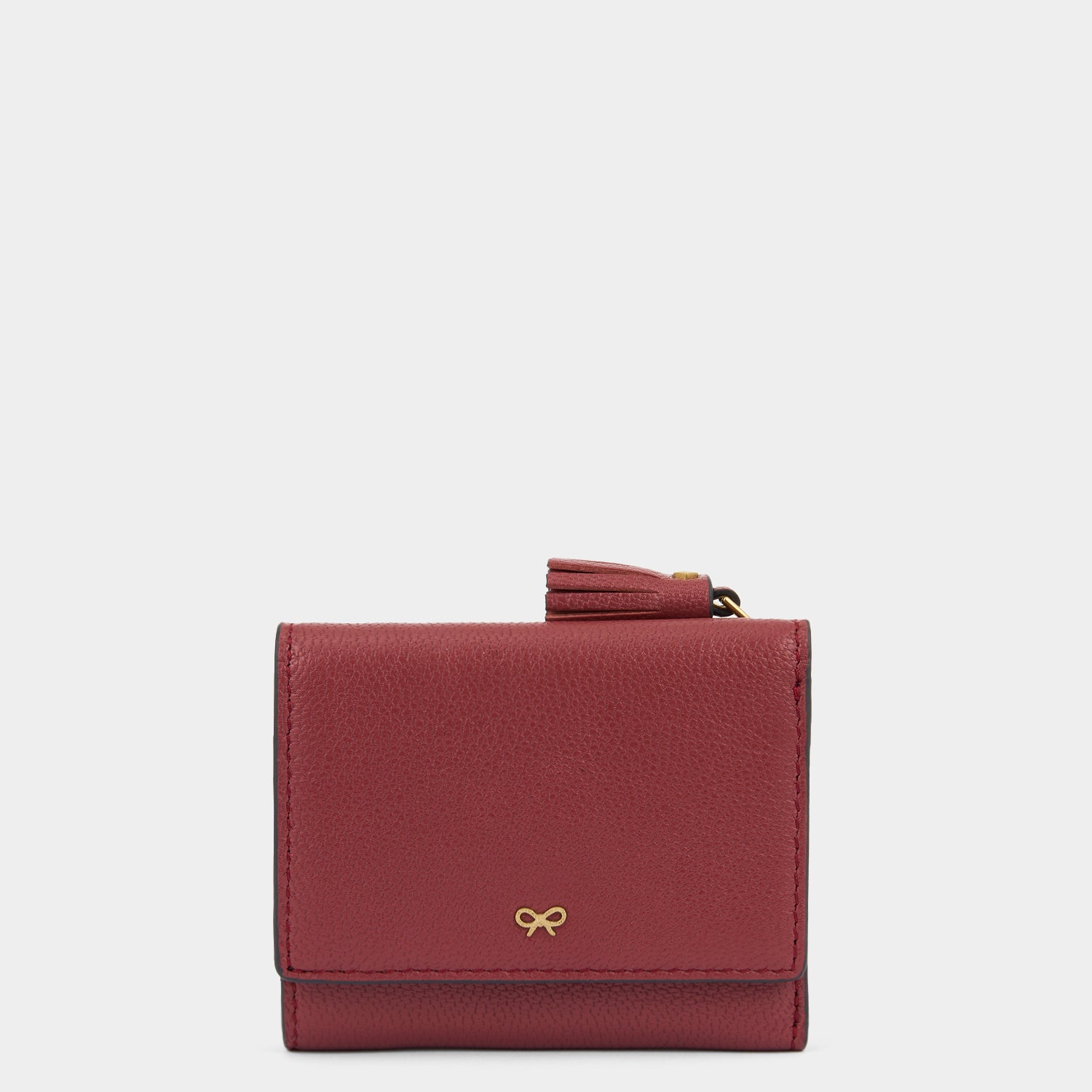 Peeping Eyes Mini Trifold Wallet -

          
            Capra Leather in Damson -
          

          Anya Hindmarch UK
