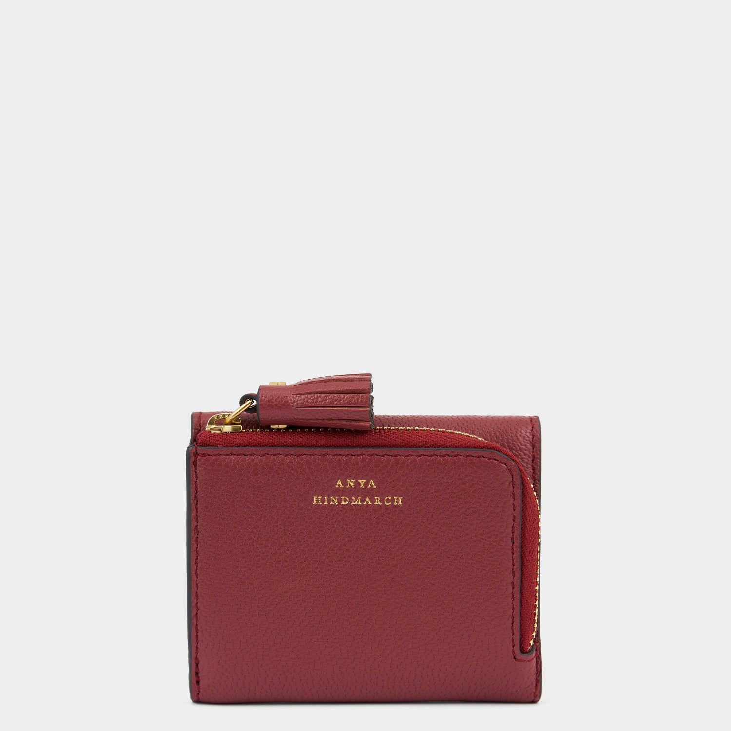 Peeping Eyes Mini Trifold Wallet -

          
            Capra Leather in Damson -
          

          Anya Hindmarch UK
