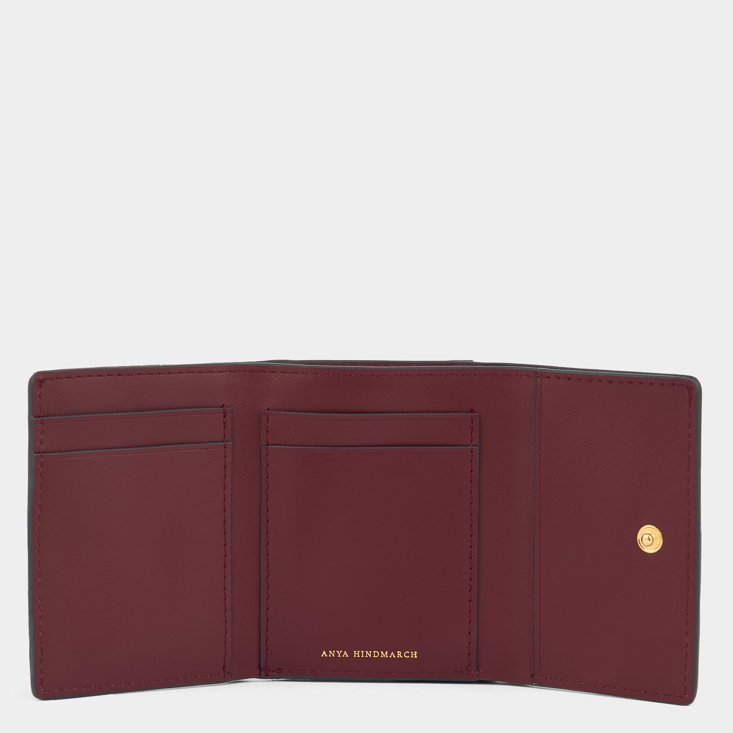 Zany Mini Trifold Wallet -

          
            Capra Leather in Grape -
          

          Anya Hindmarch UK
