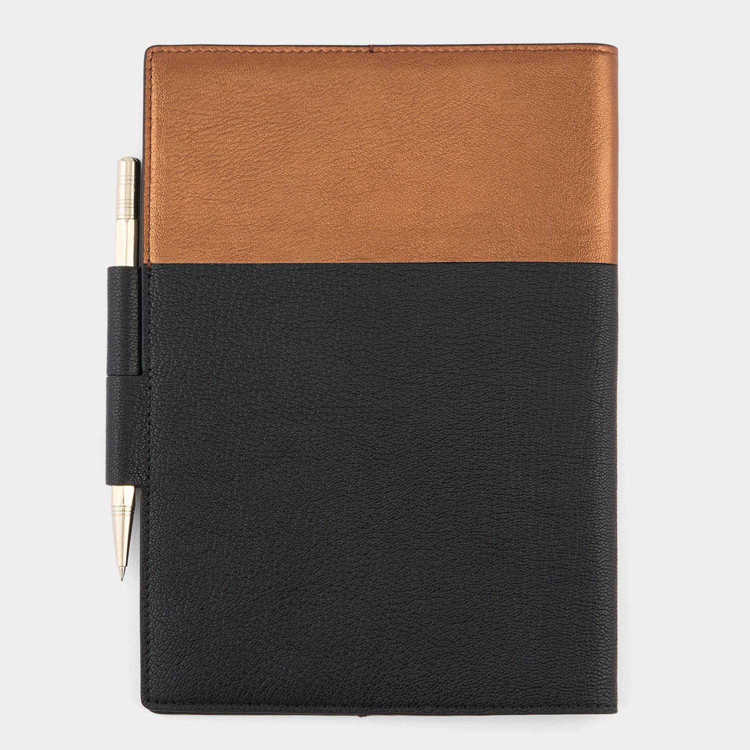 Anya Brands Duracell A5 Journal -

          
            Capra Leather in Black/Gold -
          

          Anya Hindmarch UK
