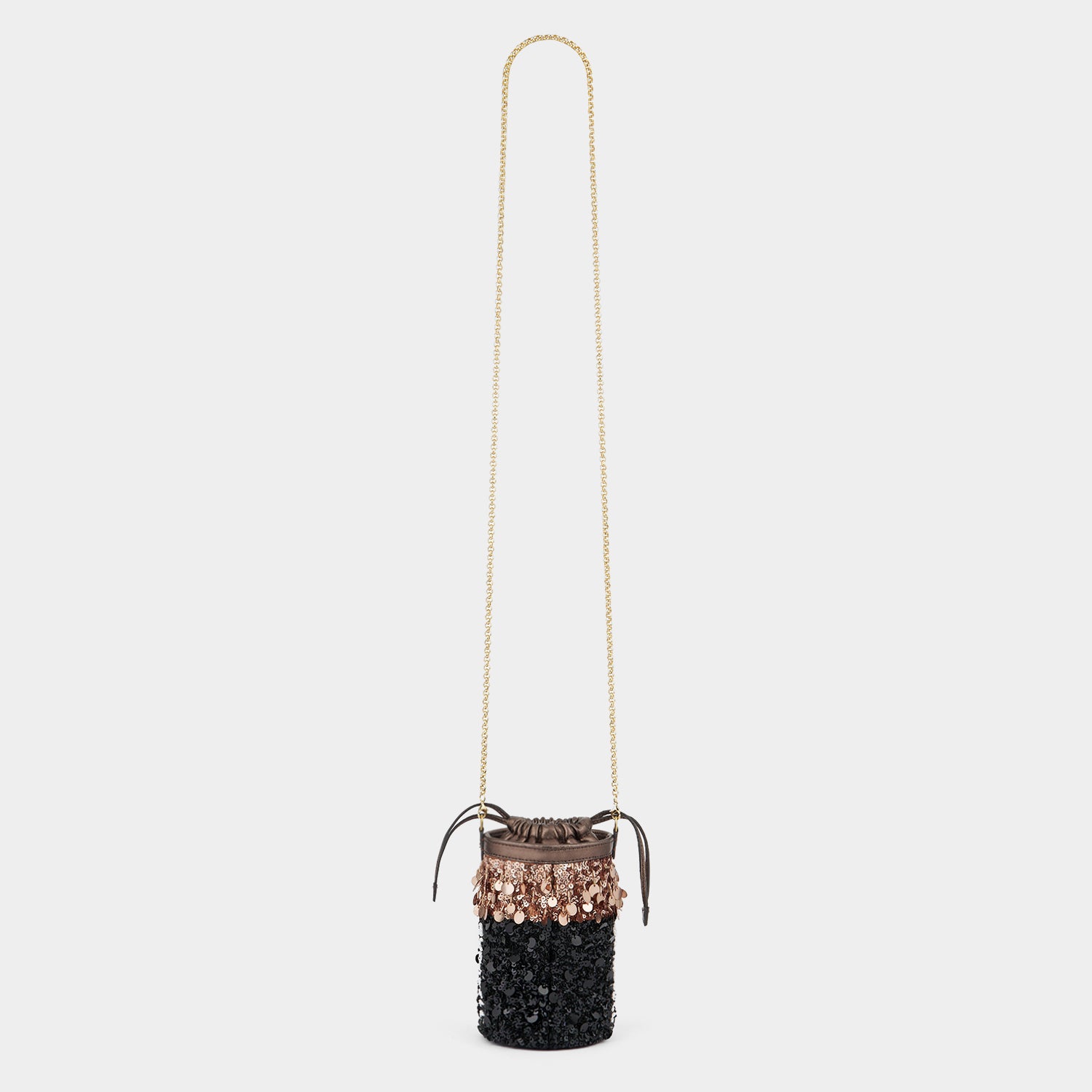 Anya Brands Duracell Mini Bucket Bag -

          
            Sequins in Black -
          

          Anya Hindmarch UK
