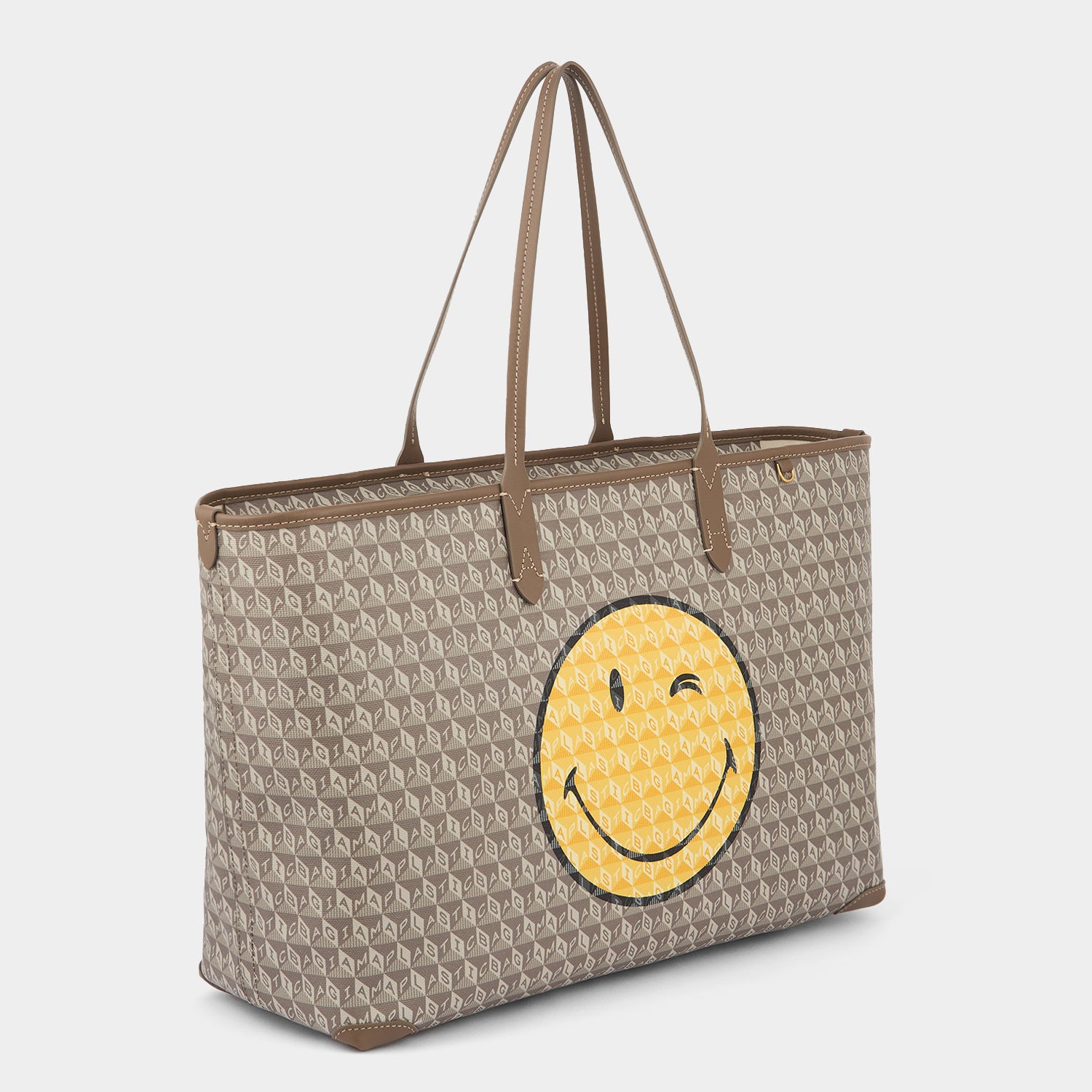 I Am A Plastic Bag Wink Zipped Tote -

          
            Recycled Canvas in Pebble -
          

          Anya Hindmarch UK
