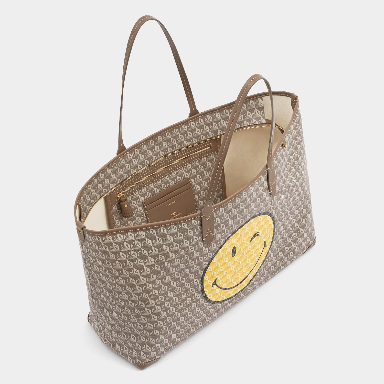 I Am A Plastic Bag Wink Zipped Tote -

          
            Recycled Canvas in Pebble -
          

          Anya Hindmarch UK
