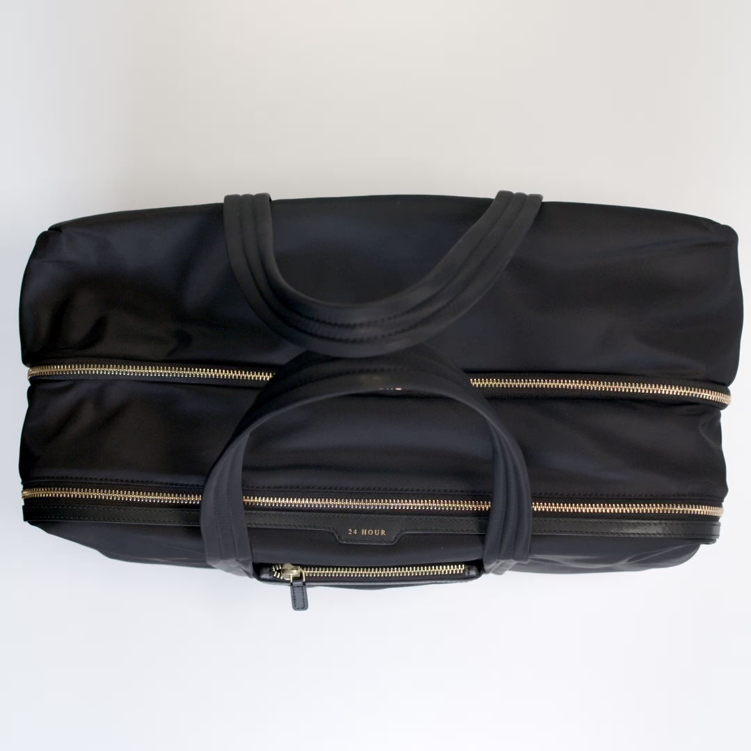 24 Hour Travel Bag -

          
            Econyl® Regenerated Nylon in Black -
          

          Anya Hindmarch UK
