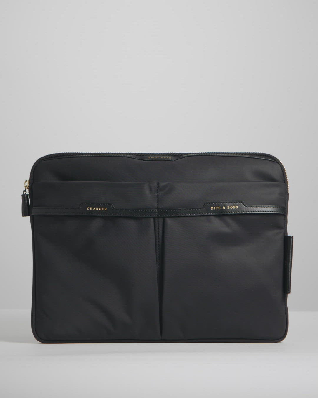 Technology Case -

          
            Econyl® Regenerated Nylon in Black -
          

          Anya Hindmarch UK
