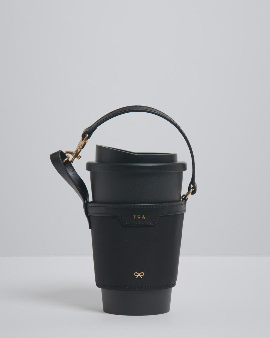 Cup Holder -

          
            Econyl® Regenerated Nylon in Black -
          

          Anya Hindmarch UK
